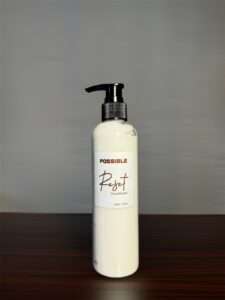 milky conditioner in a transparent 250 ml bottle named as Reset Conditioner with black screw pump